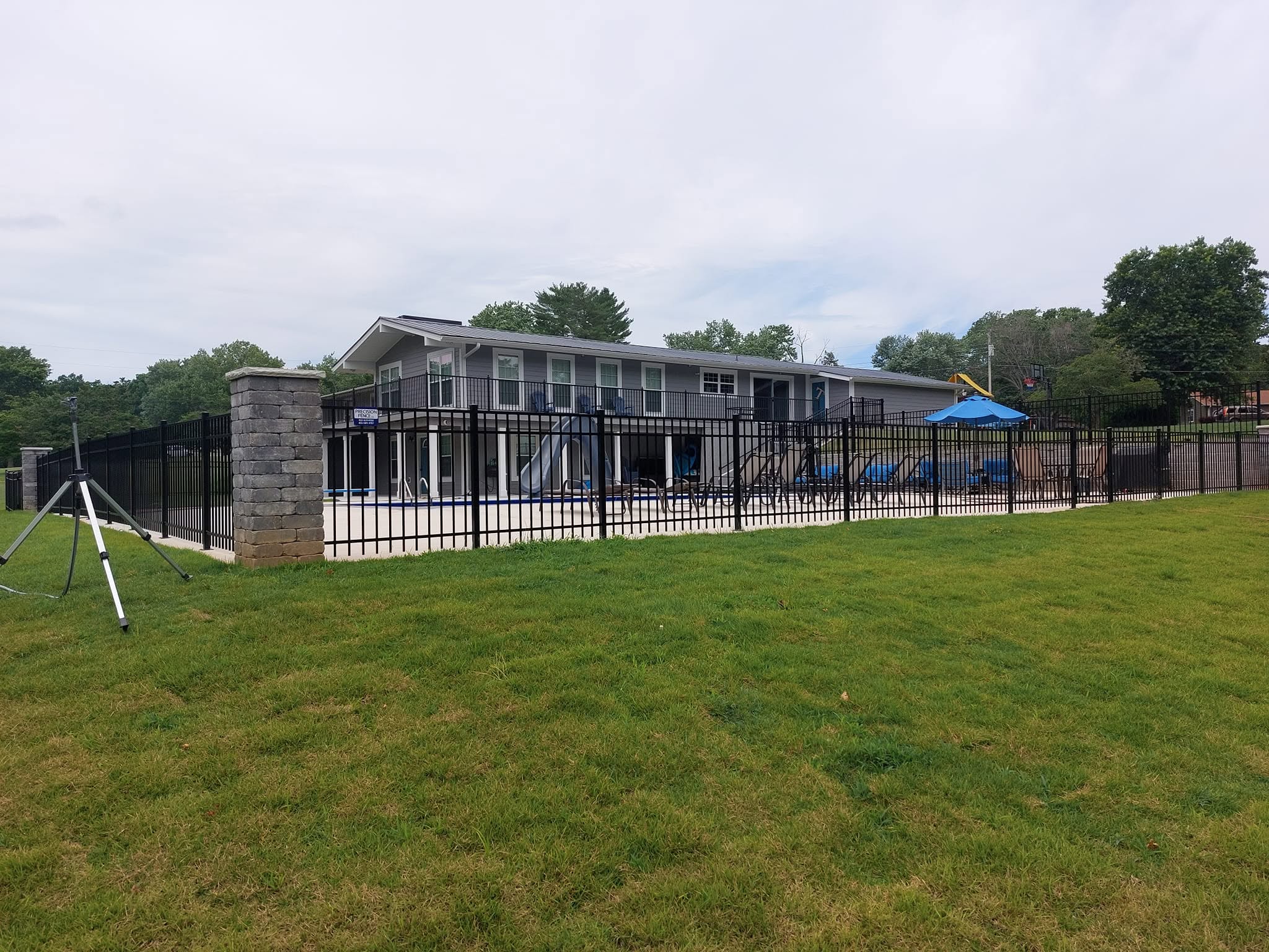 Wooden cross-buck ranch fence built by Precision Fence Company in Columbia, Tennessee